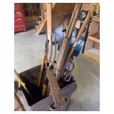 Barrel of yard tools