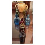 11 miniature bottles ( 4 have corks ) and double handled maple leaf vase