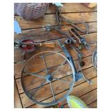 Antique metal wheel 12” diameter, vintage egg beater, hay hook, misc tools