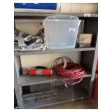 Contents of 3 lower shelves, tub, trash bags, extension cord, fire extinguisher, miscellaneous