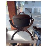 Antique cast iron pot with lid on stand