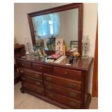 Dresser with glass top , some wear noted along front 60”x20”x 35” and mirror is 55”x33”