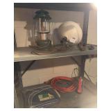 2 clip on work lights, camping Coleman lantern, extension cord, golf travel bag, miscellaneous