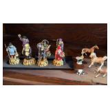 vintage set of Japanese Seven Lucky Gods (Shichifukujin) miniature celluloid or resin figurines on a black display, bone China miniature horses and  a tiny cow and bee