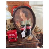 vintage 1973 Coca-Cola Oval Serving Tray featuring a reproduction of a 1923 advertising illustration of a young woman holding a glass of Coca-Cola. vintage 1971 Coca-Cola metal serving tray featuring 