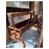 Vintage cast iron newspaper log roller