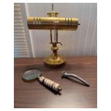 Brass desk lamp, magnifying glass with carved handle, inside release handle