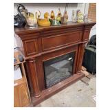 Electric fireplace, working condition unknown, 44”w x 15”d x 41”h, items on top excluded
