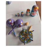 Russian stacking dolls and chicken motion toy, Mexican Morocco’s