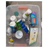1tubs of party supplies, plastic sippy cups,  1 gallon glass dispenser, 1 tub of Christmas tins