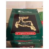 Christmas electrical outdoor extension cords and house spot lights and 3 Trim a Home lighted decorations and one 20” light sculpture