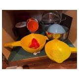 Strainers, funnels, small pitcher, angel food cake pan, mixing bowl