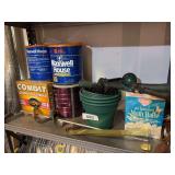 Moth balls, plastic planters, 2 wreath hooks, 3 spray nozzles, roach traps, bird feeders, hummingbird feeders
