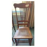 Vintage spindle-back rocker with cane bottom 16" w x 37" t