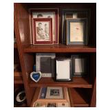3 shelves of frames