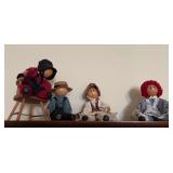Row of wooden head dolls