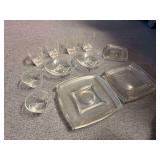 Lot of clear glass dishes with swirl design