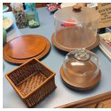 Wicker napkin holder, Cheese dome, 2 wooden cake plates one with plastic cover