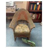 Child’s vintage wicker rocking chair and wooden painted cat