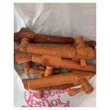 Several wooden barrel bungs