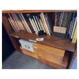 2 shelves of cookbooks and recipe boxes with recipes