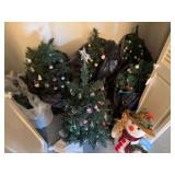7 small decorated Christmas trees, snowman