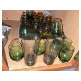 Lot of green glass juice glasses, grey glasses, amber glasses