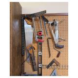 Various hand saws, squares, levels, hardware cabinets