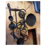 #3 Cast iron skillet , 4 horse bites ,vintage chipping hammer and vintage citrus squeezer , melting ladle , vintage wire coil egg whisk