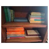 2 shelves of old scout books , medical books , etc .