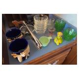 8 green depression uranium glass custards, pink depression glass cup and candlestick, 6 Fireking small bowls, juicer, 2 moose mugs, mouse timer,  Jadeite measuring cup