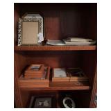 3 shelves of frames