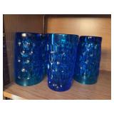8 blue art glass glasses with thumbprint pattern