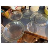 Clear baking bowl with lid, 3 misc size glass lids, 4 glass pie pans