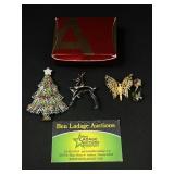 4 Christmas and floral brooches