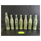 7 Antique Coca Cola Glass Bottles