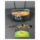 Lady on a bike knife and tin