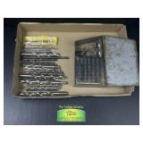 Drill bits and drill bit metal storage