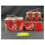 Coca Cola carrying tins