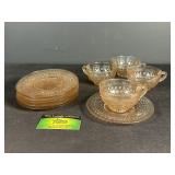 Pink Depression glass cups and saucers