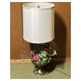 Lamp with metal base that has flower vase attached