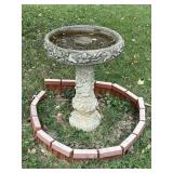 Birdbath surrounded by fake brick façade
