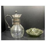 Glass pitcher with metal lid and green glass
