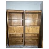 Two pressboard bookshelves