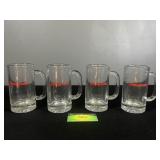 Four Snap On clear steins
