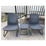 Two plastic woven chairs and small table