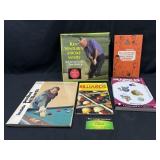 Books on golfing, pool, and marbles