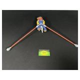 Bear Figurine Balancing On Bike