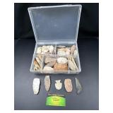 Native American arrowheads in plastic case