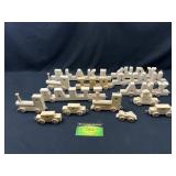 Wooden train and car pieces with names on them